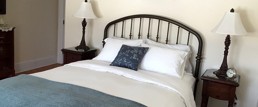 Our Traditional Guest Rooms also have wrought iron beds, and private bathrooms with a tub and shower combination